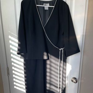 Ladies black dress, wrap style top.